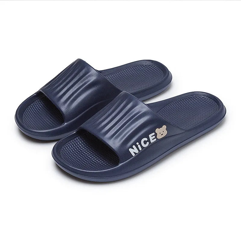 Adult unisex EVA bathroom slippers with cartoon pattern and non-slip sole in multiple colour options
