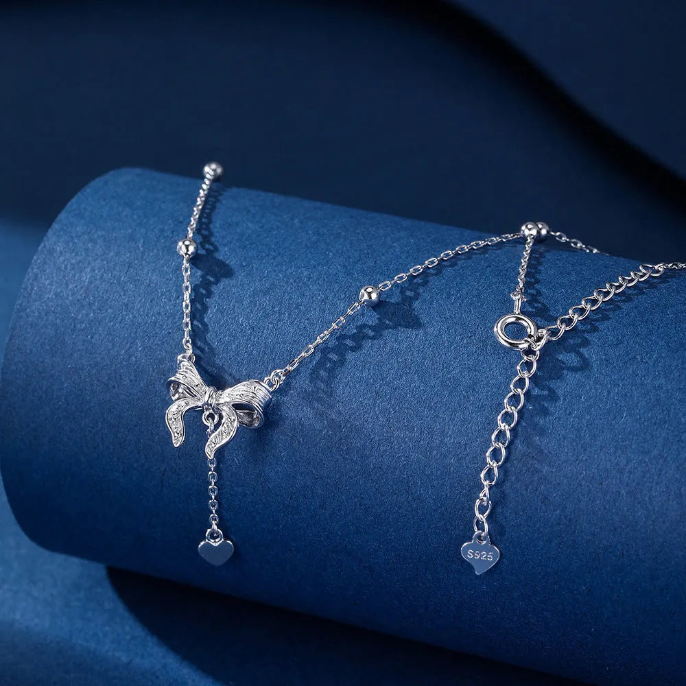 S925 silver necklace with heart and bow pendant on an O-ring chain