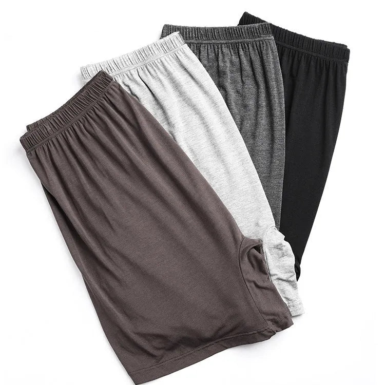Mannequin wearing solid black high waist modal boxer shorts for men