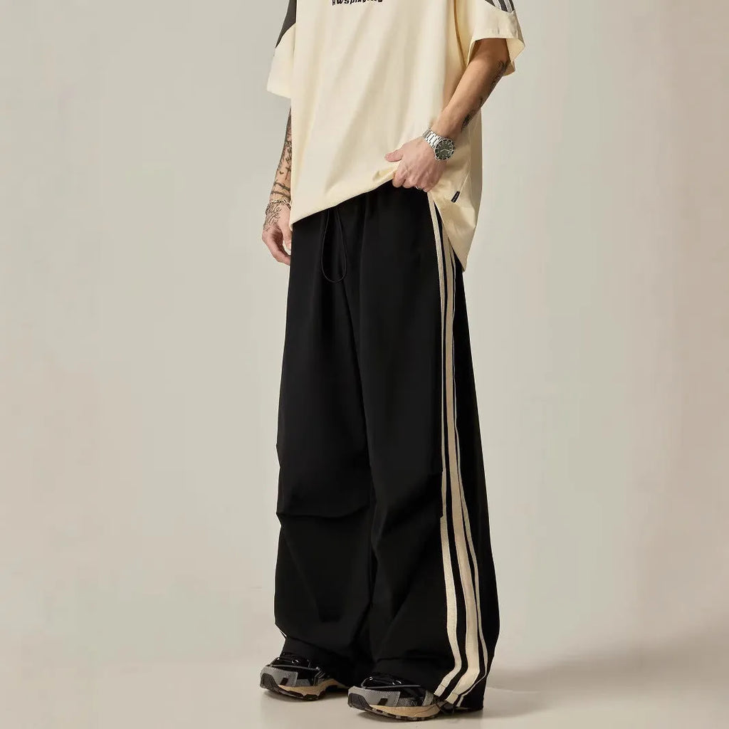 Men's black wide-leg climbing trousers with high waist and straight-leg design