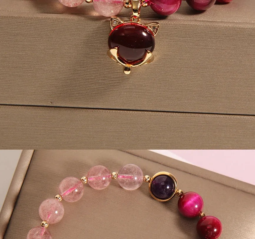 Strawberry crystal bracelet with elastic rope on wrist showing 18cm circumference