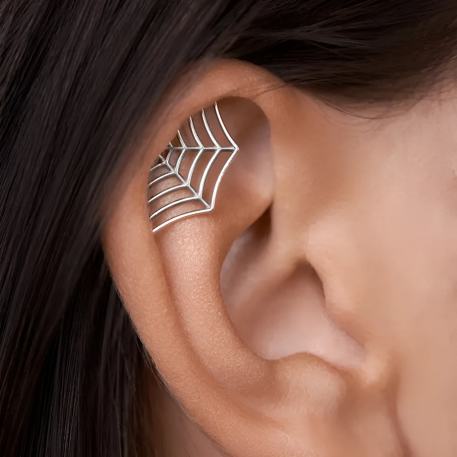 Spider web pattern stud earrings in electroplated gold and silver metal finishes
