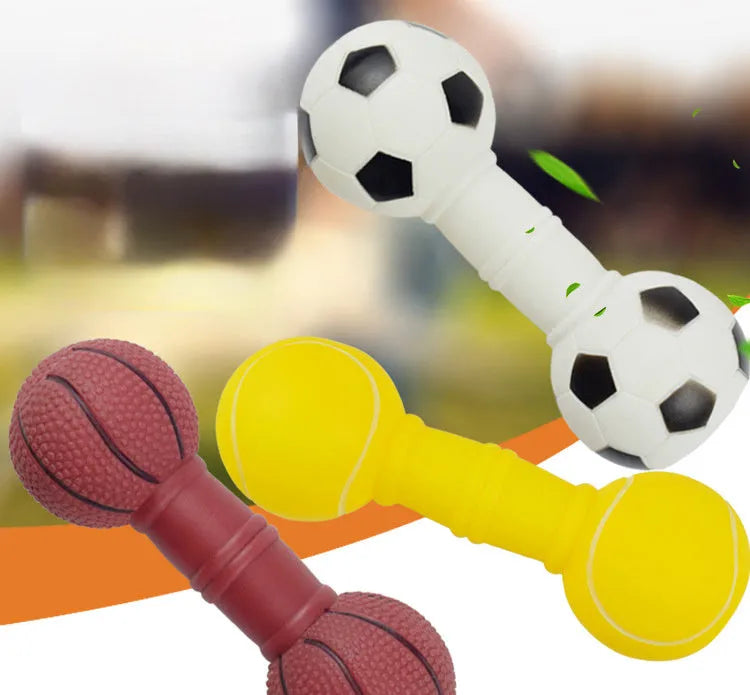 Brown orange white yellow PVC football dumbbell shaped squeaky dog chew toy on a plain background.