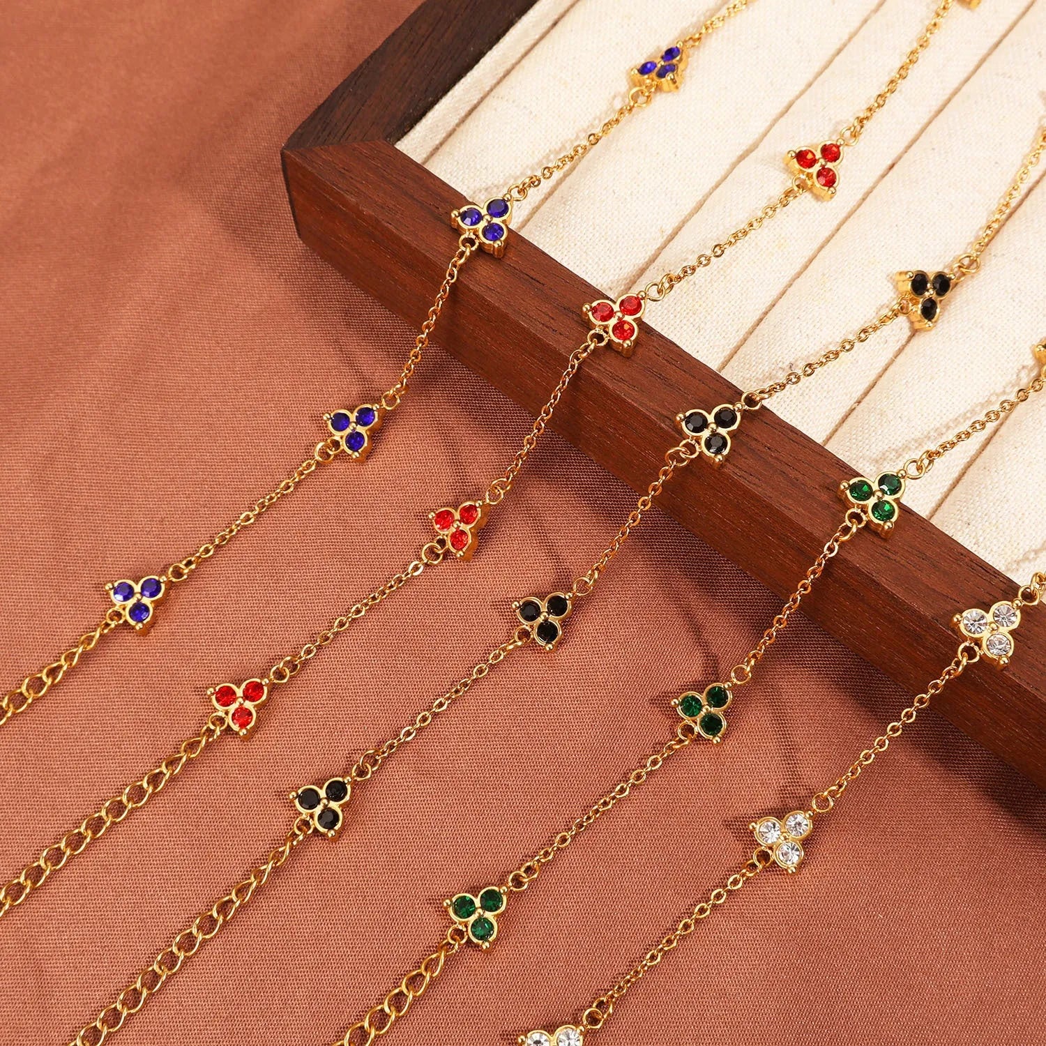 Women's stainless steel bracelet with three geometric diamond designs in various colour options