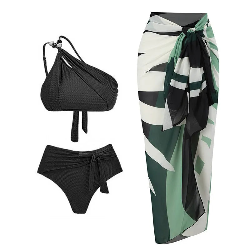 Brown high waist bikini with padded halter top and a sheer black chiffon overdress on a mannequin.