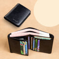 Men's black leather wallet open to show internal card slots, coin pocket, photo holder, and document section.