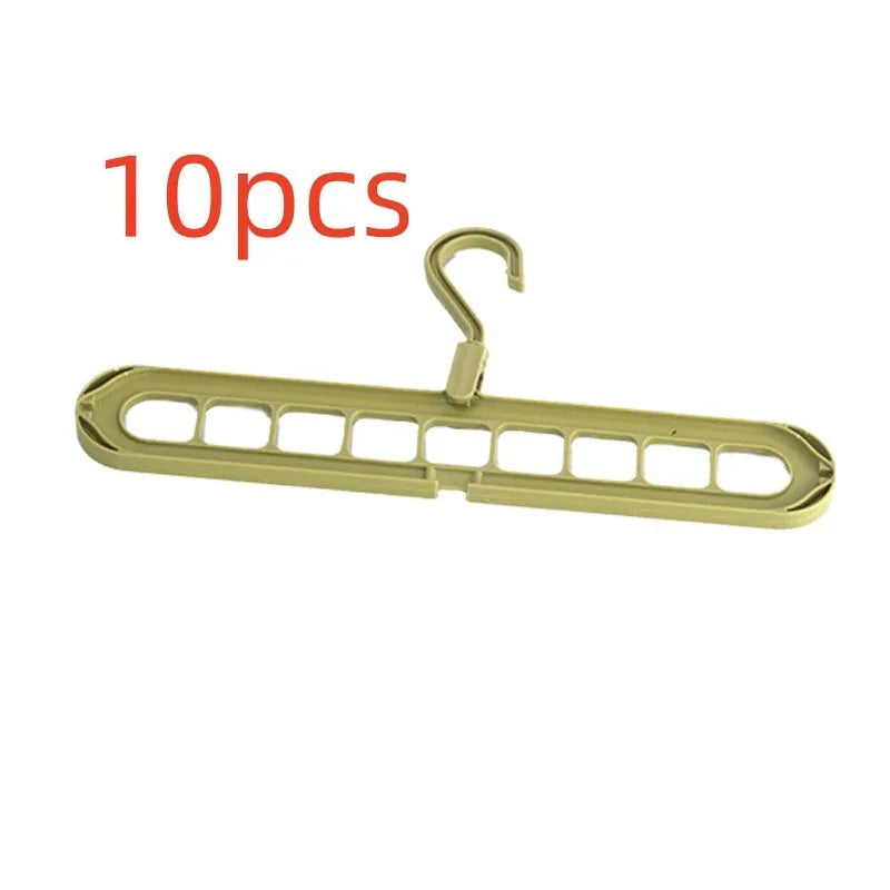 Green plastic nine-hole hanger folded flat showing multiple trouser hanging points