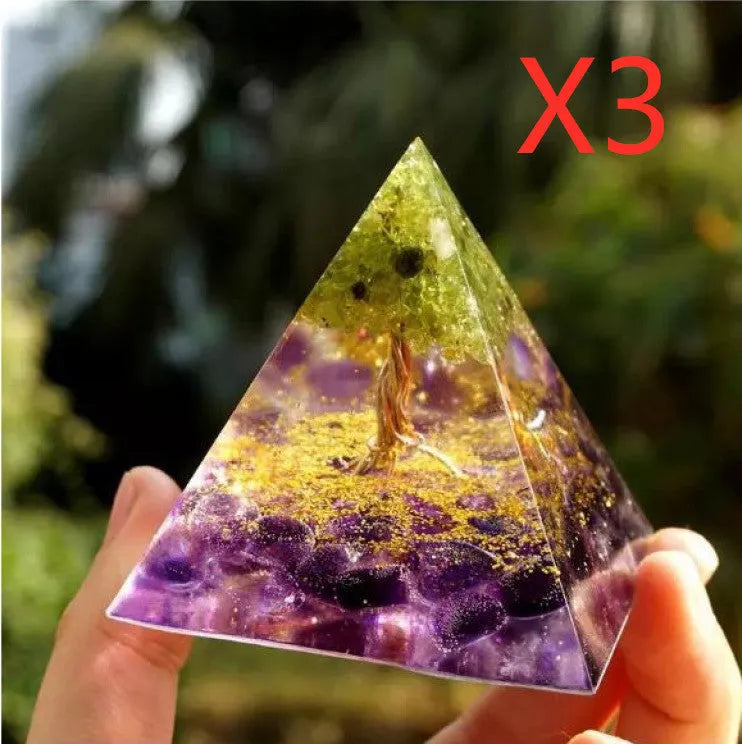 Clear epoxy resin pyramid ornament with embedded coloured crystal gravel inside, measuring 6cm.