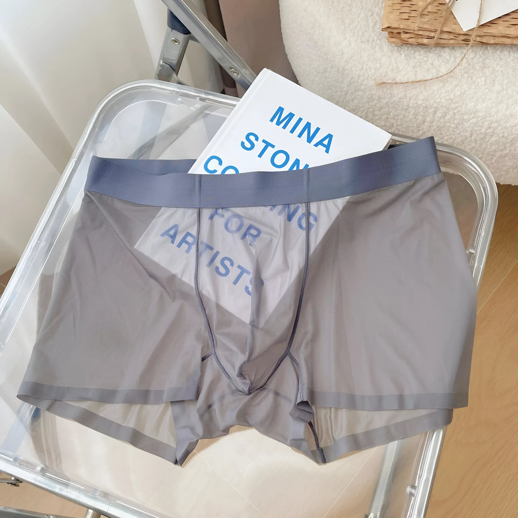Thin breathable men's boxer shorts in seamless quick-drying nylon fabric showing mid waist design