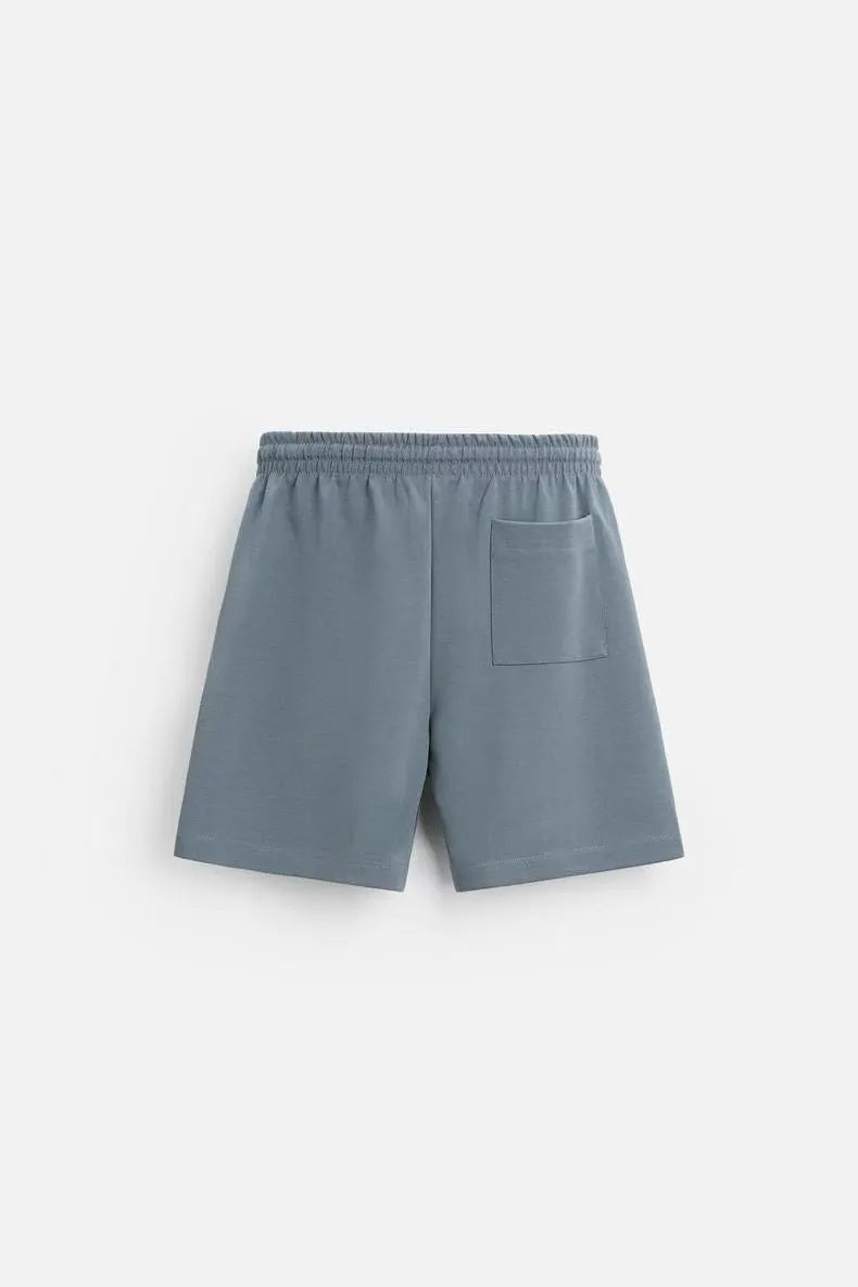 Loose blue polyester T-shirt and matching shorts set on a hanger, showing round neck and double-sided texture.