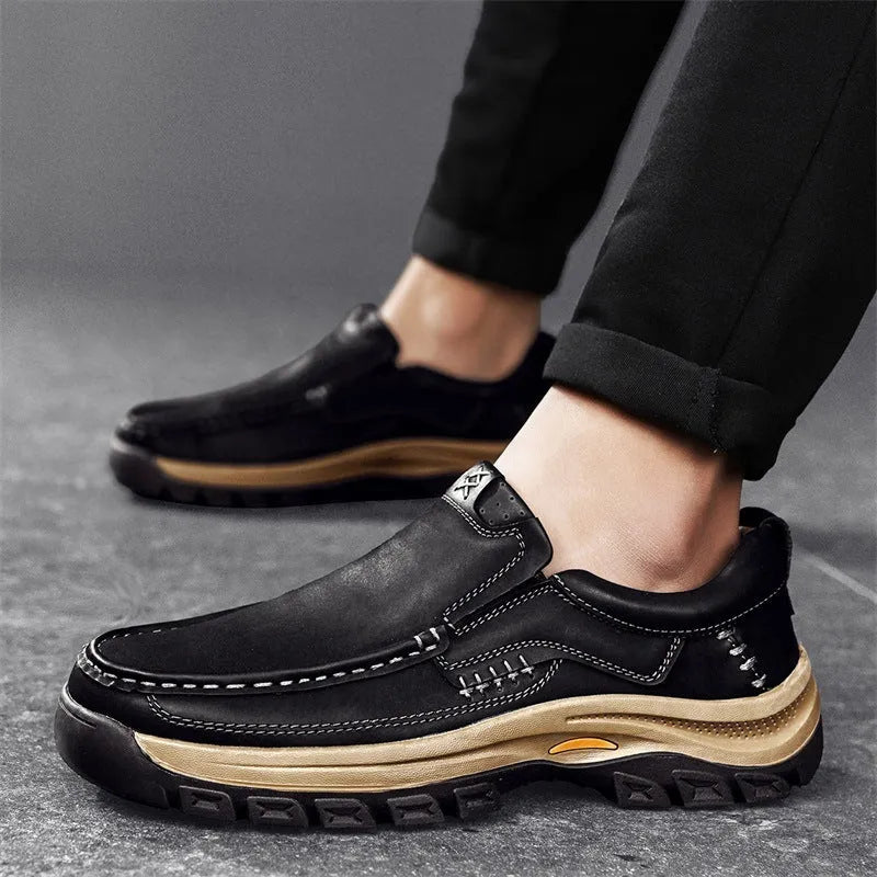 Men's black mountaineering shoes with thick rubber soles and round toe design for outdoor hiking