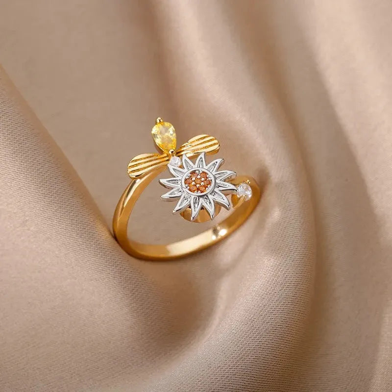 Copper rotatable decompression ring with adjustable opening in gold or platinum electroplated finish