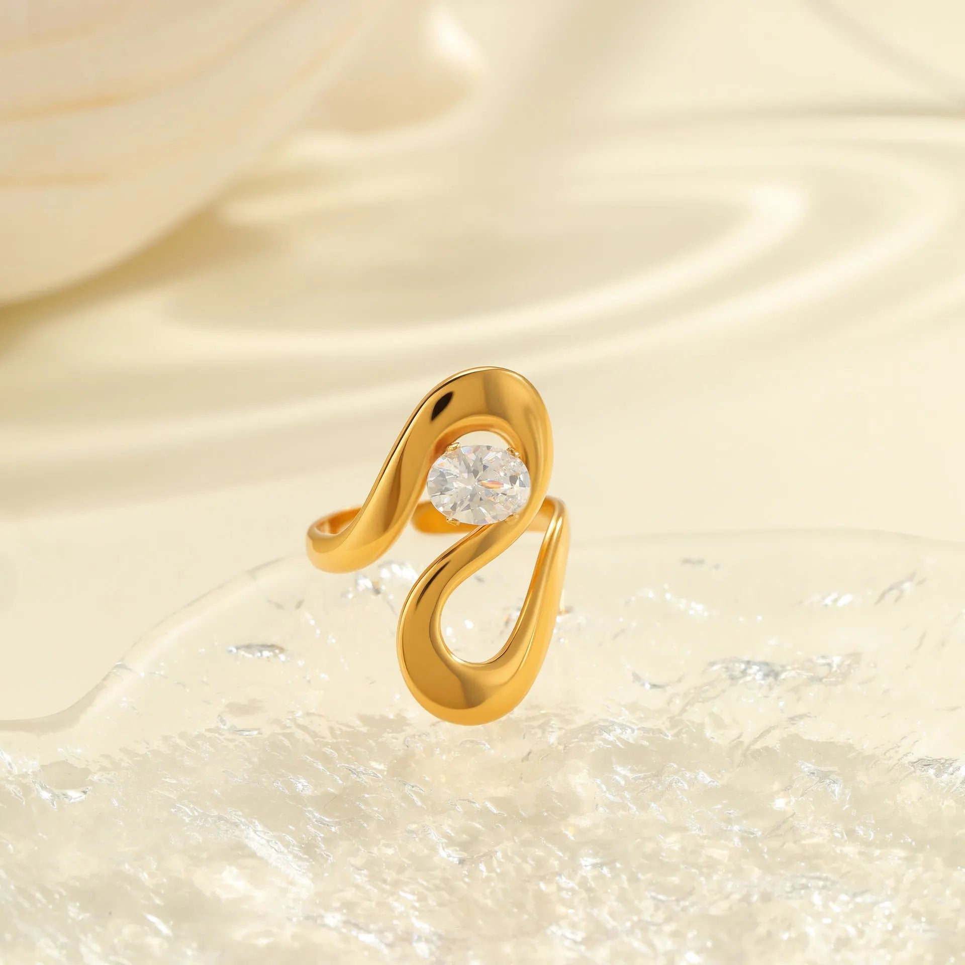 Geometric stainless steel zircon ring with open mouth design on a hand.