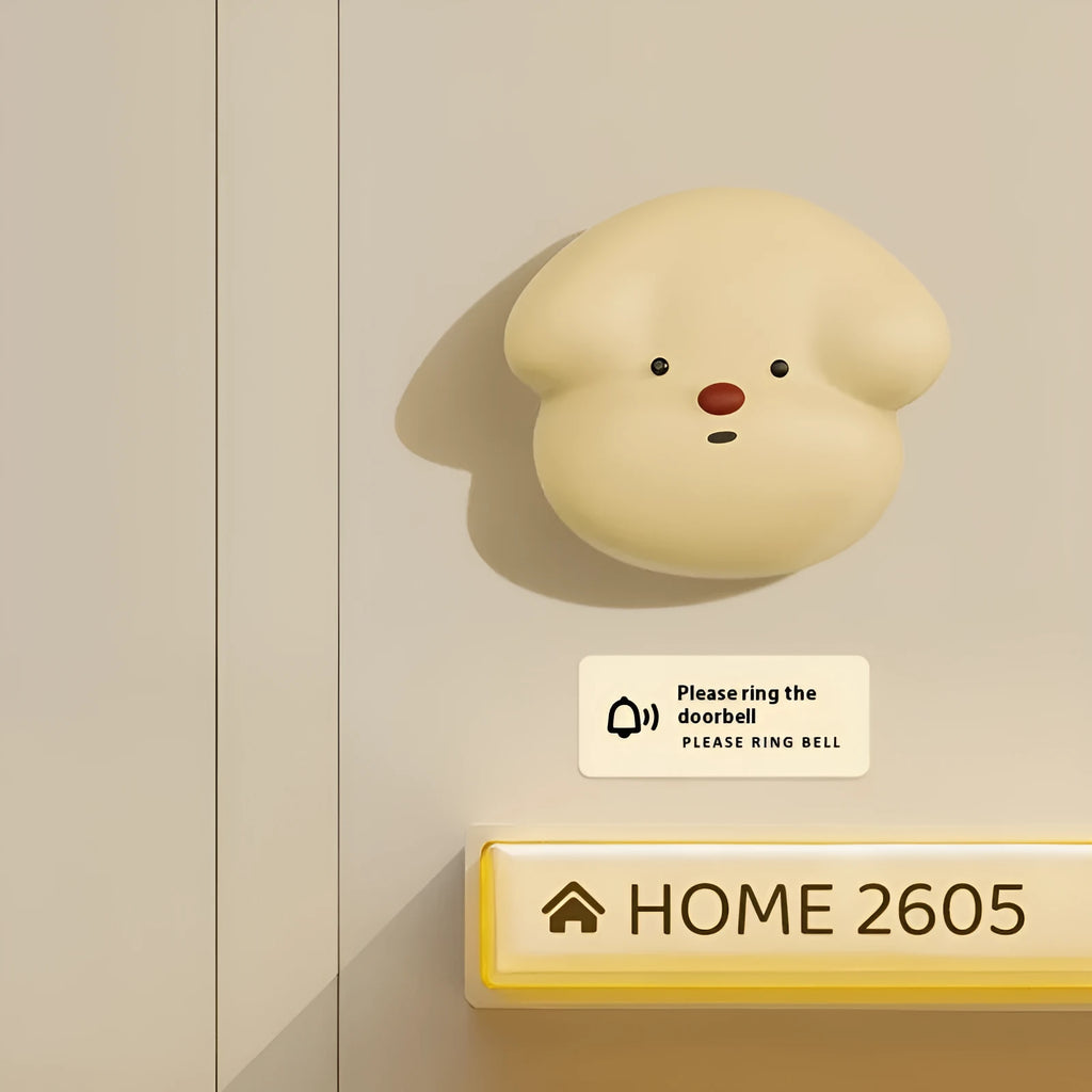 Wireless plug-in doorbell in milky yellow or white for household entryway use