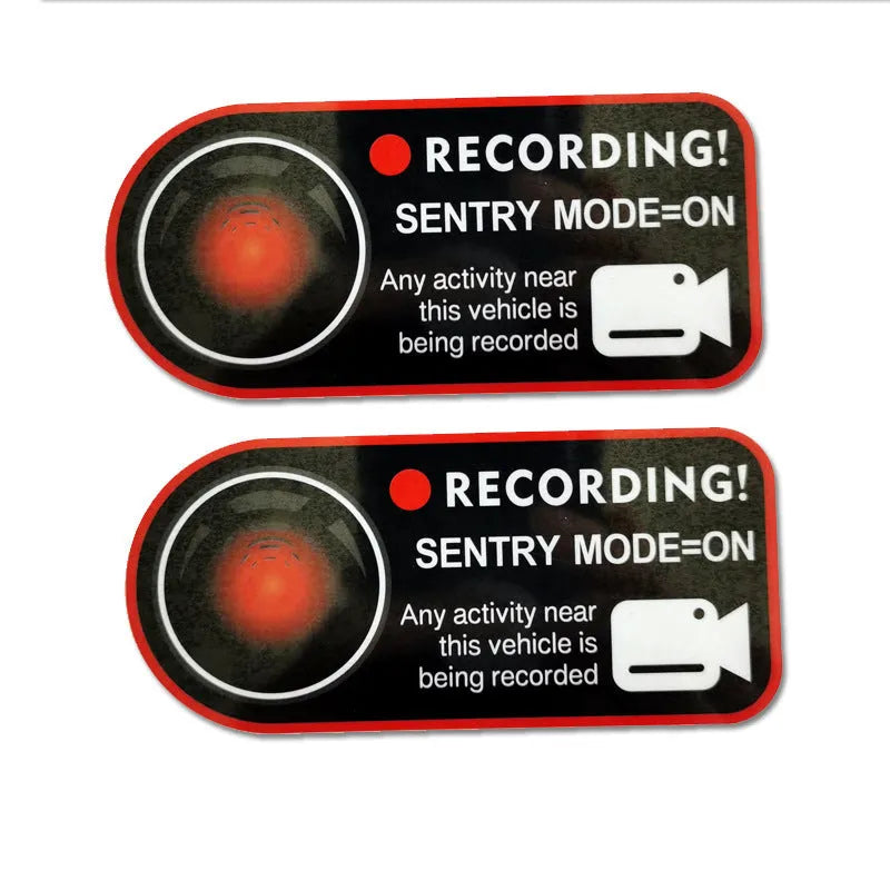 Pair of white rectangular electrostatic warning stickers for Tesla Sentry Mode, measuring 11cm by 5cm.