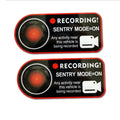 Pair of white rectangular electrostatic warning stickers for Tesla Sentry Mode, measuring 11cm by 5cm.