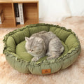 Grey reversible donut cat bed showing sherpa and velvet sides, suitable for indoor cats.