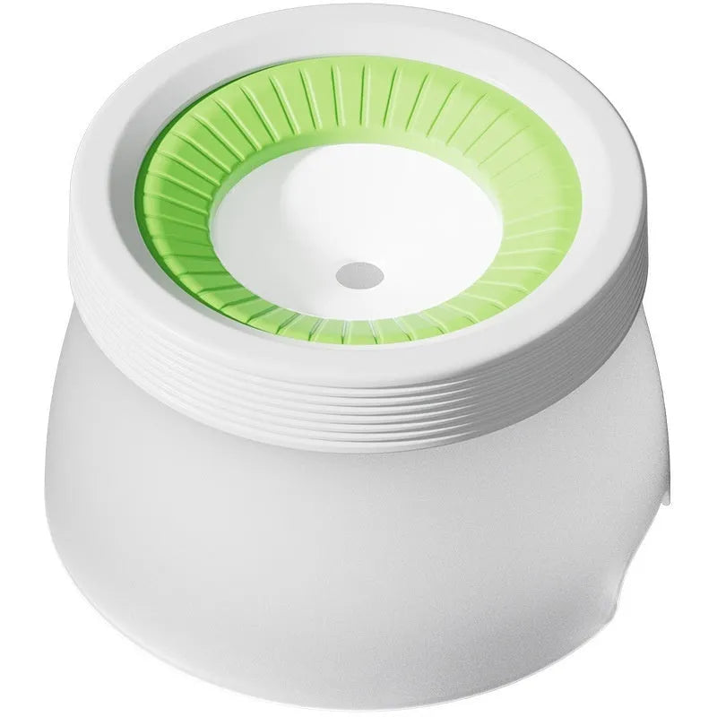 Green suspended non-spill water bowl for dogs and cats, showing the elevated bowl above the base plate