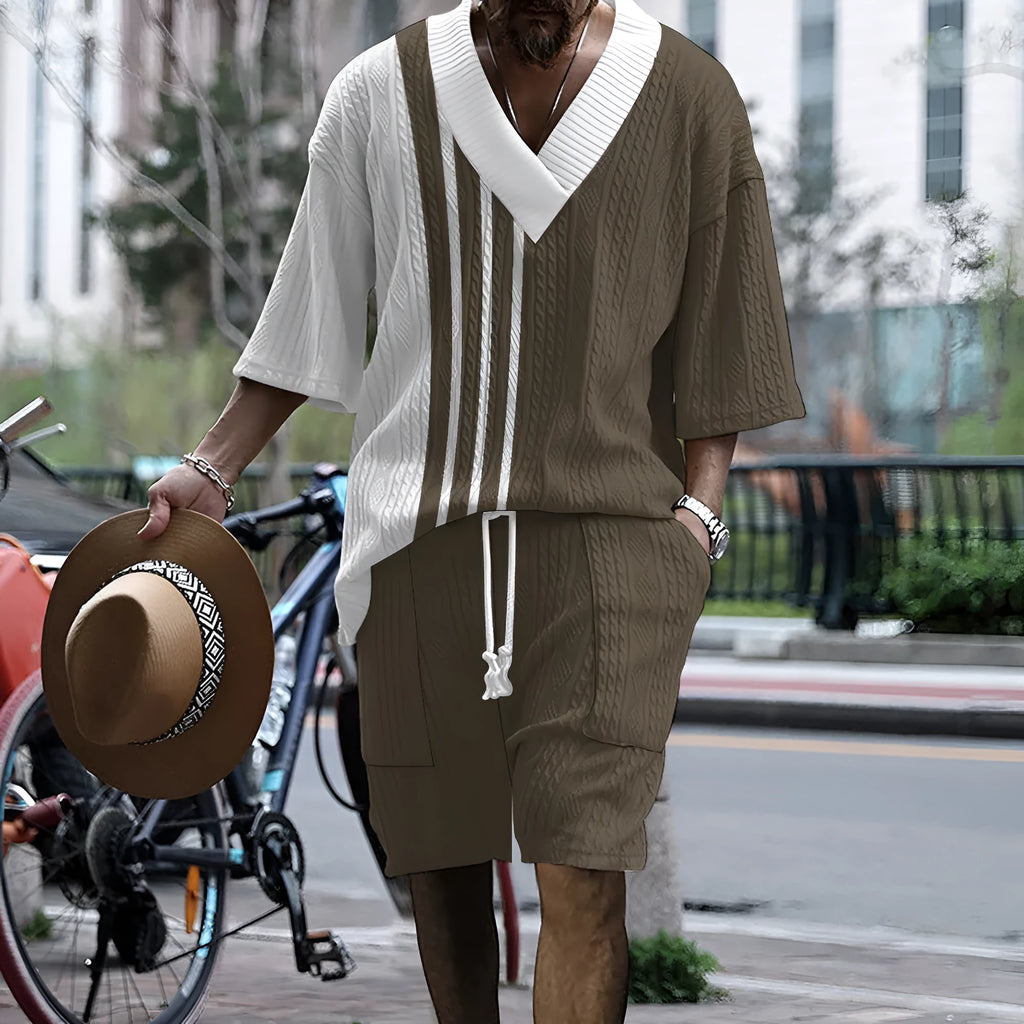 Printed men's knitted drop-shoulder short-sleeved top and matching shorts set in a polyester blend.