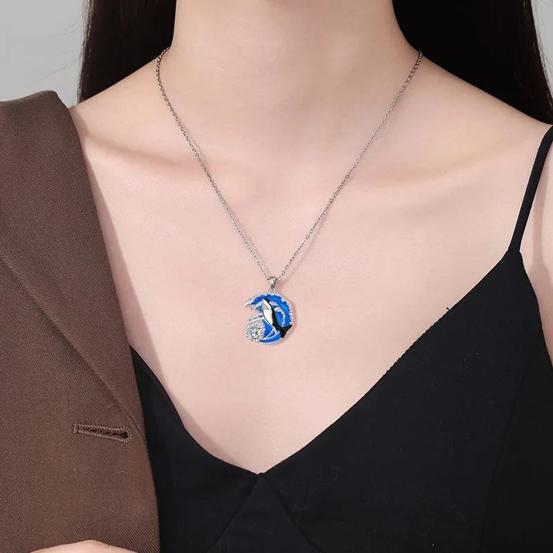 Women's shark pendant necklace with copper electroplated finish on a cross chain
