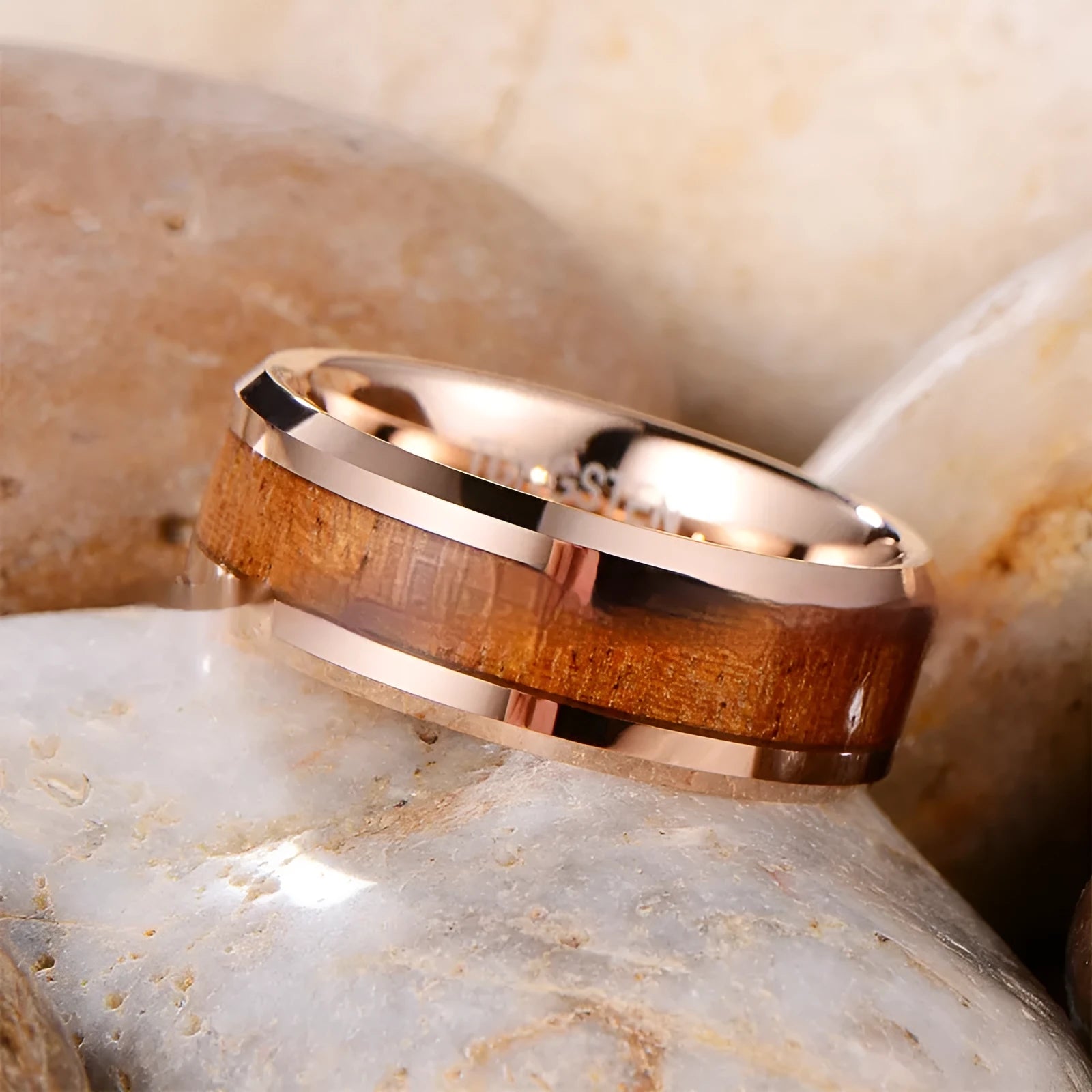 Ugyen tungsten ring showing U-shaped cross-section, 8mm wide band, in rose gold finish.