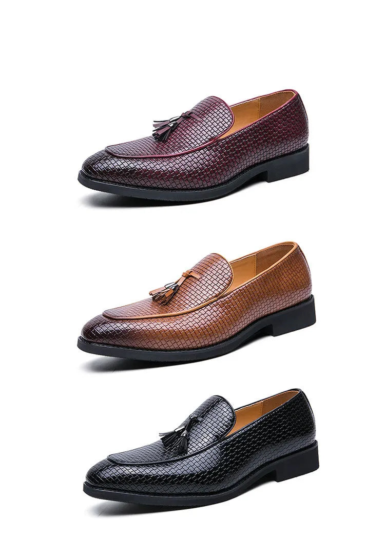 Men's black pointed slip-on business shoes with tassel detail on artificial PU upper.