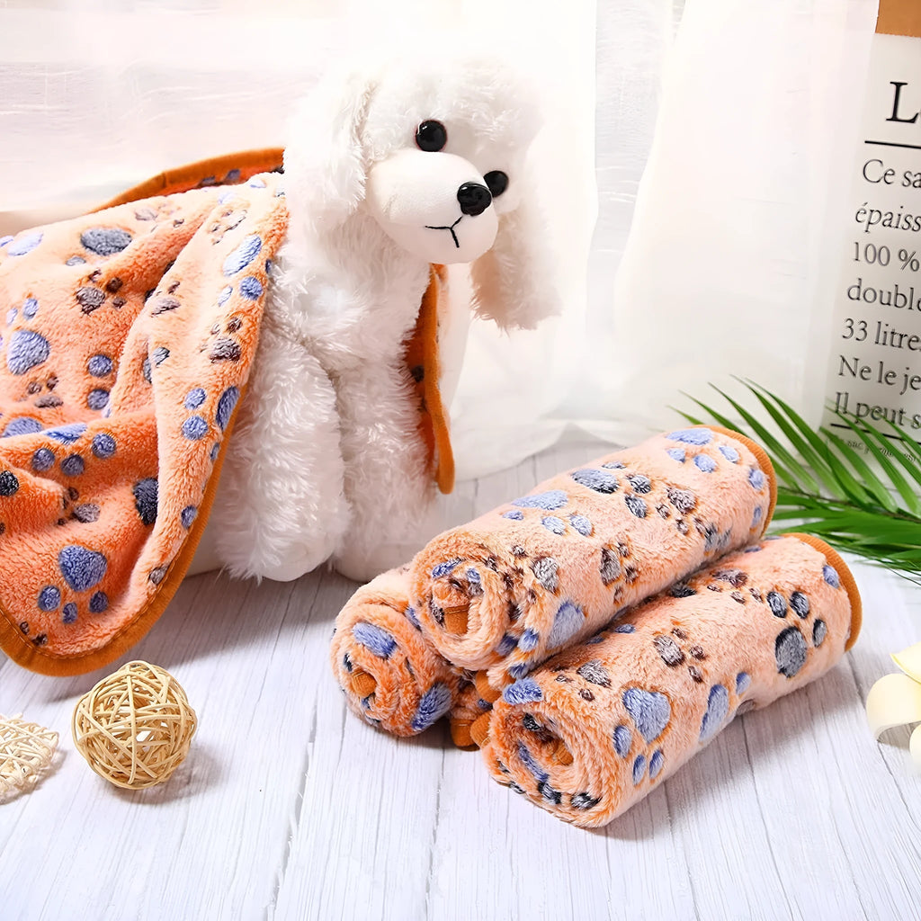 Coral fleece dog blanket with paw print design in multiple colour options
