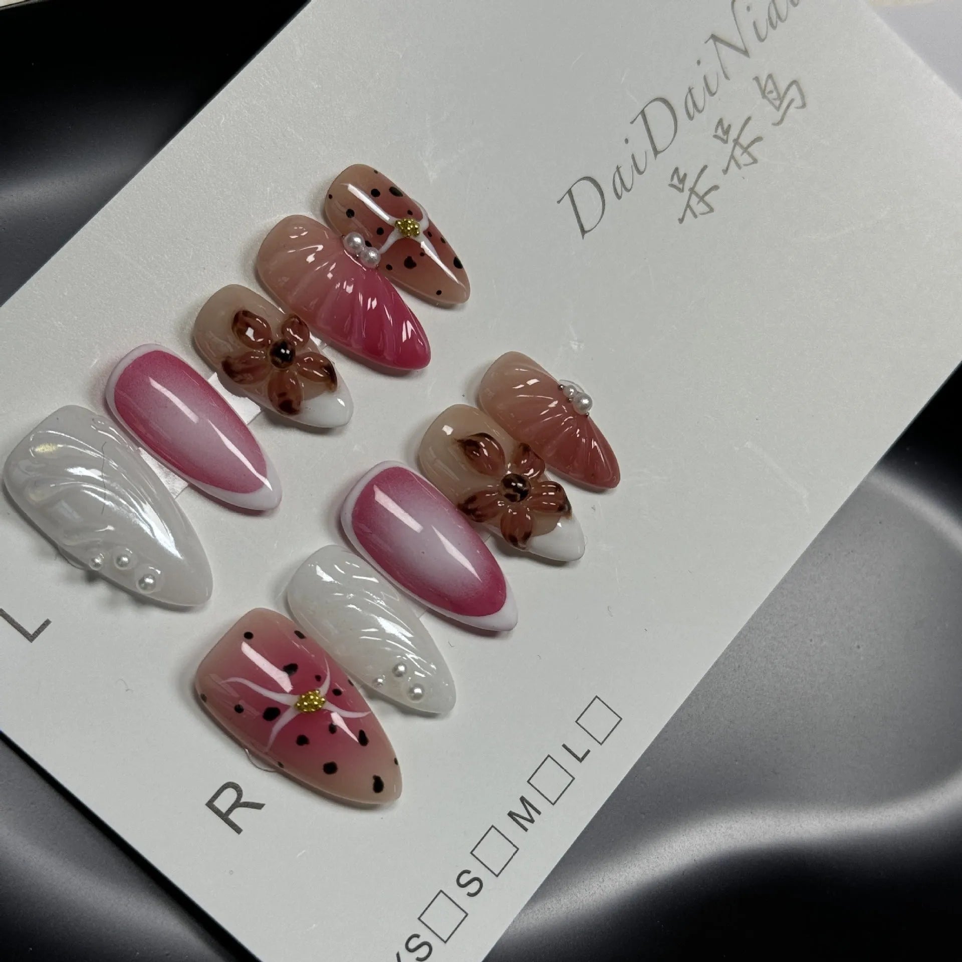 Hand-painted 3D carved nail patches showing embossed candy patterns in colourful designs.