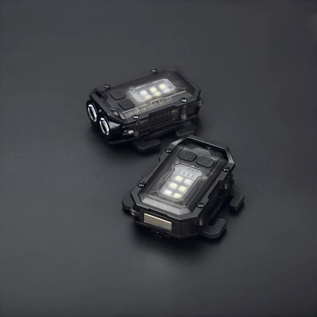 Portable mini tactical warning flashlight with USB charging cable on a backpack strap.