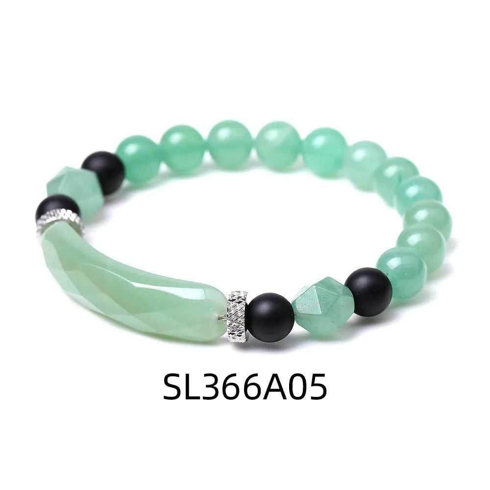 Handmade diamond-shaped cut agate bracelet in a geometric, fan-shaped design on a wrist.