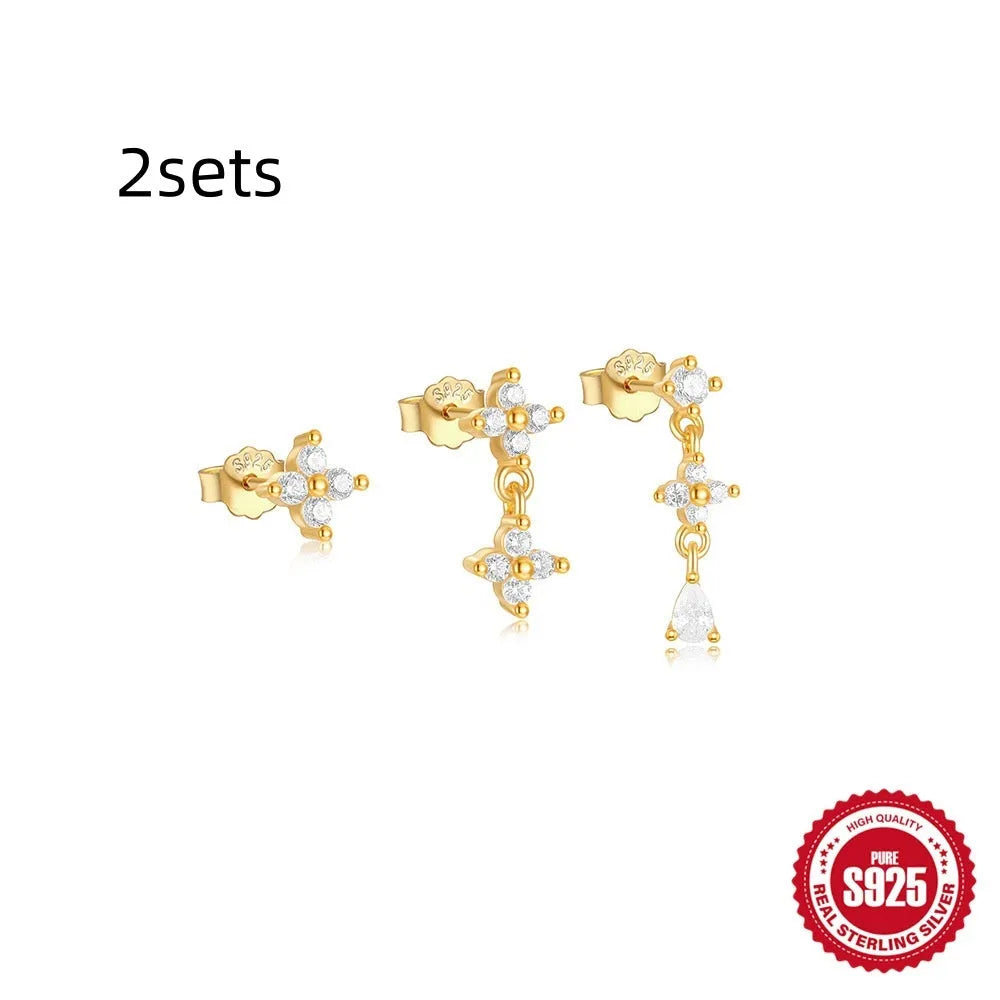 Three pairs of geometric zircon tassel earrings in sterling silver with gold tone variations