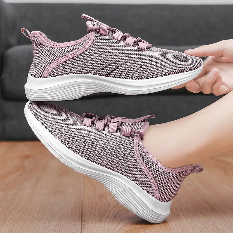 Women's low-top casual sneakers in black, grey, or pink with breathable mesh upper and lightweight EVA sole.