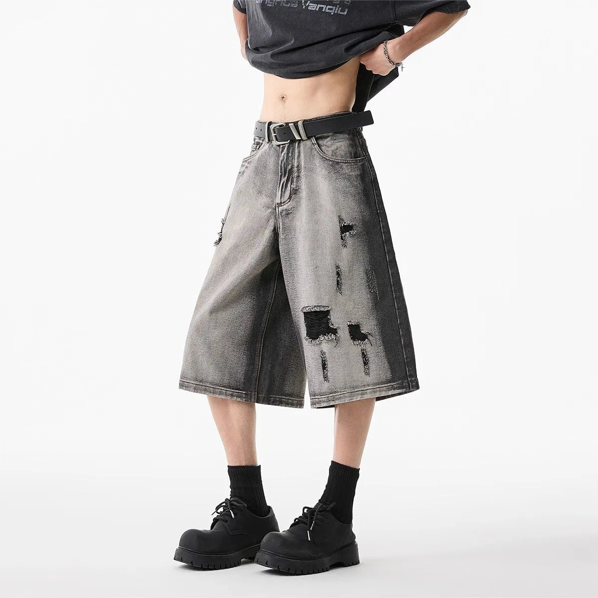 Grey water washed denim shorts with hole detailing and loose cropped fit