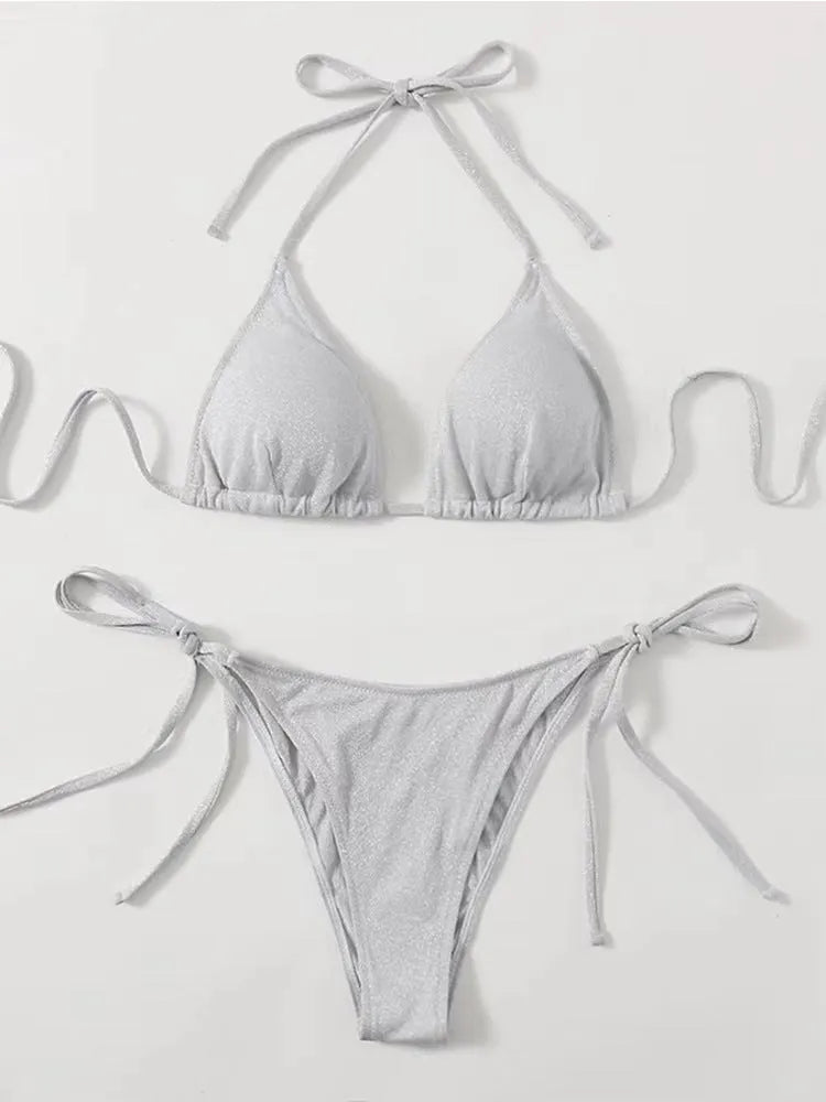 Women's split bandage bikini swimsuit in polyester fabric showing colour options and styling