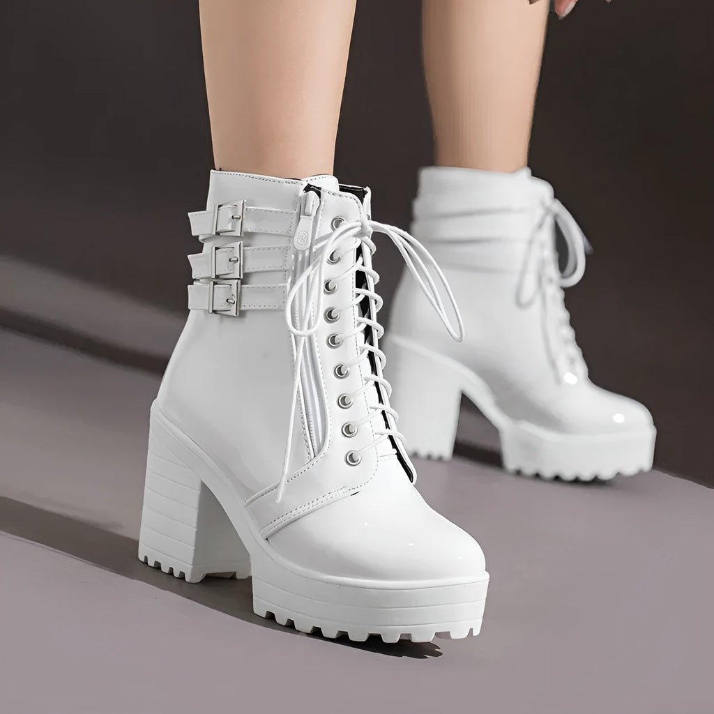 Women's black thick-heel ankle boots with round toe and front lace-up design.