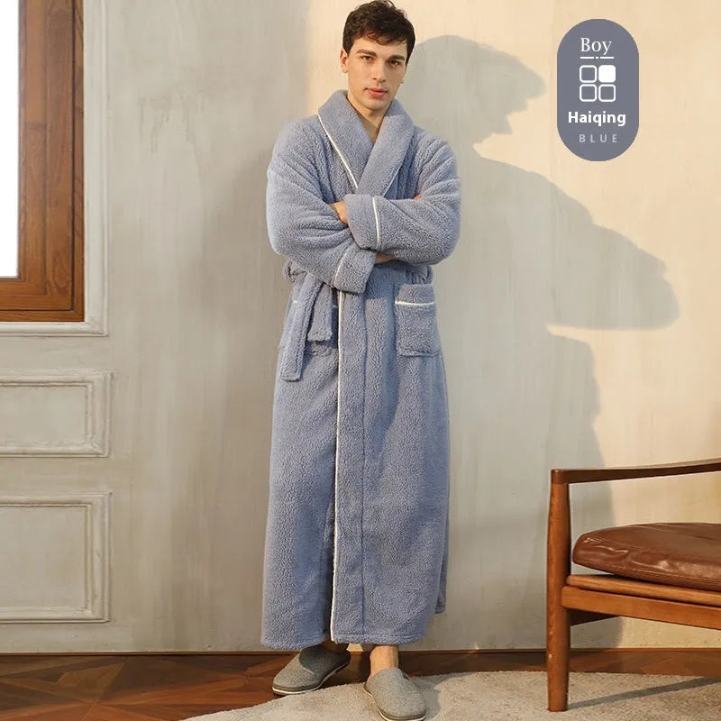 A man and woman wearing matching thickened flannel couple's bathrobes in a winter colour.
