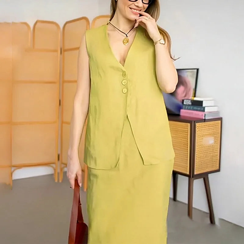 Women's blue polyester two-piece set with sleeveless vest and long skirt on a hanger.