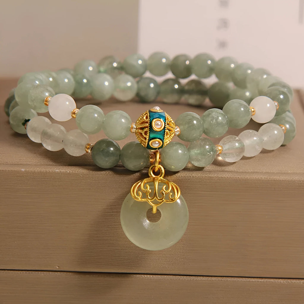 Women's double-layer aventurine jade bracelet with safety buckle and rhinestones.