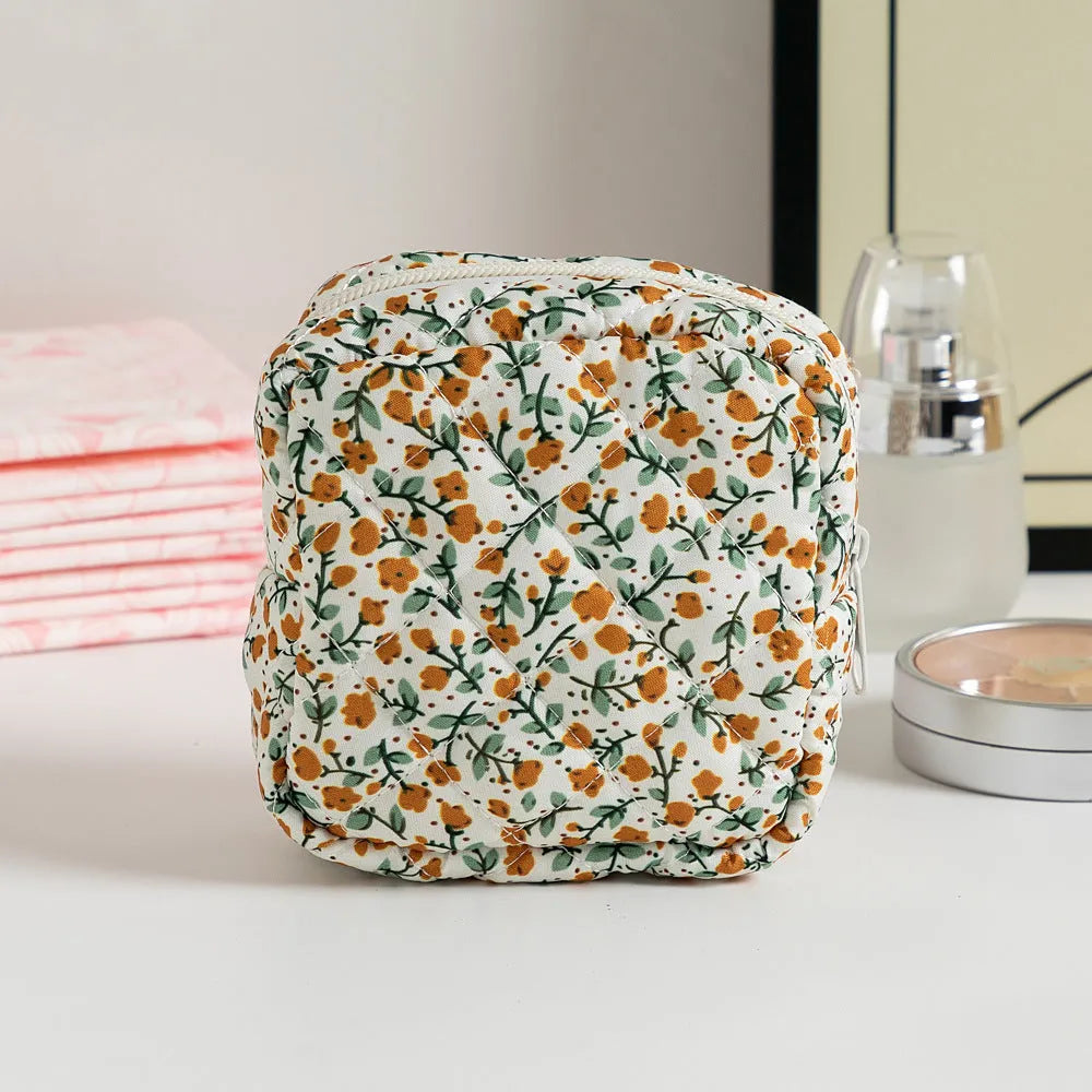 Women's floral patterned polyester key storage bag with sewing thread detail.