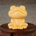 Solid bamboo carving ornament of smiling frog design measuring 5cm height and 4.5cm diameter