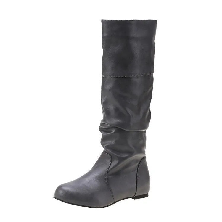 Women's black flat slip-on boots with round toe and high ankle shaft.