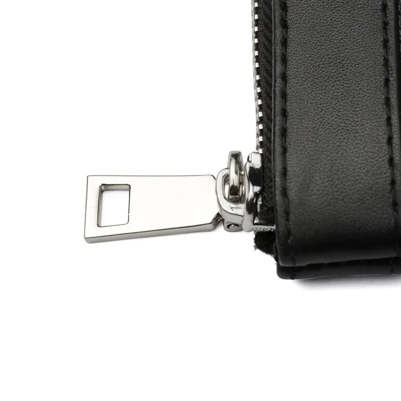 Black genuine leather men's clutch wallet showing cowhide texture and 20x10cm dimensions