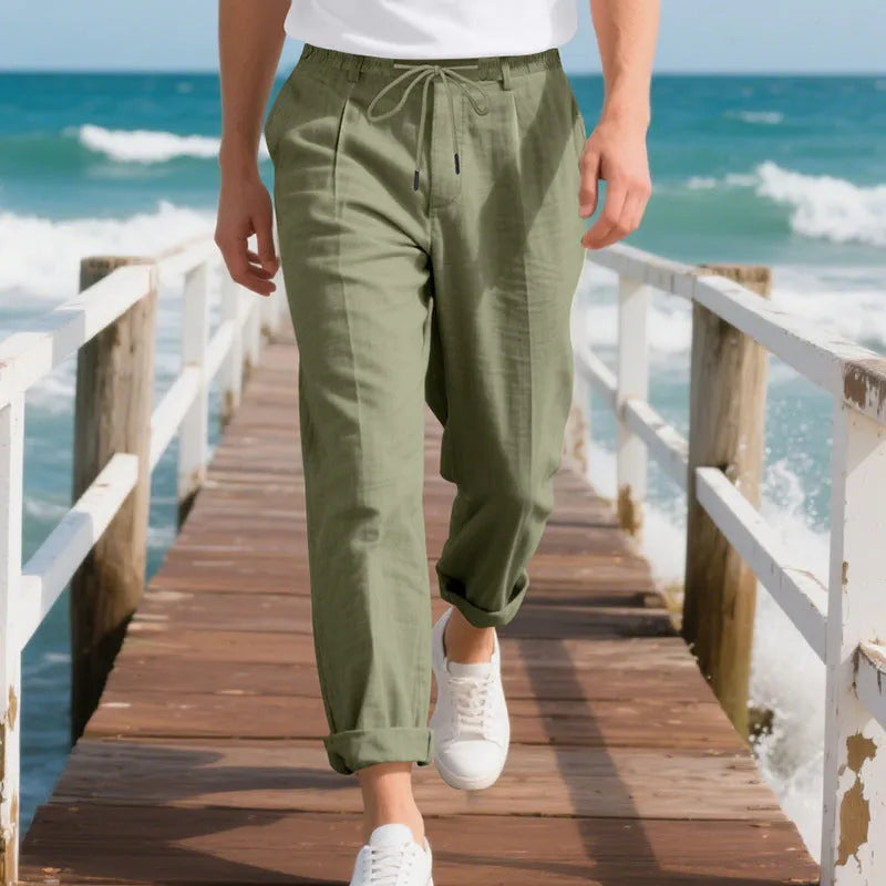 Men's light khaki linen casual trousers with a drawstring waist and straight-leg fit on a hanger.