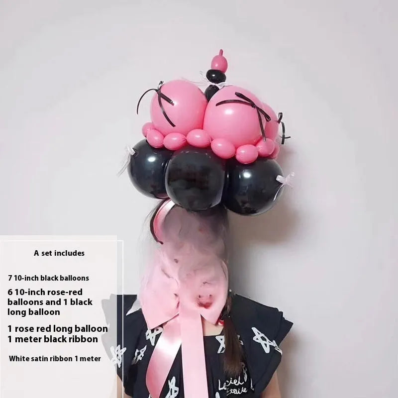 Finished round balloon bouquet decoration for cake table centrepiece.