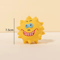 Four colourful natural latex squeaky dog balls with bumpy texture and cute faces