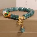 Blue water jade abacus beads crystal bracelet with white agate and rhinestone accents on alloy