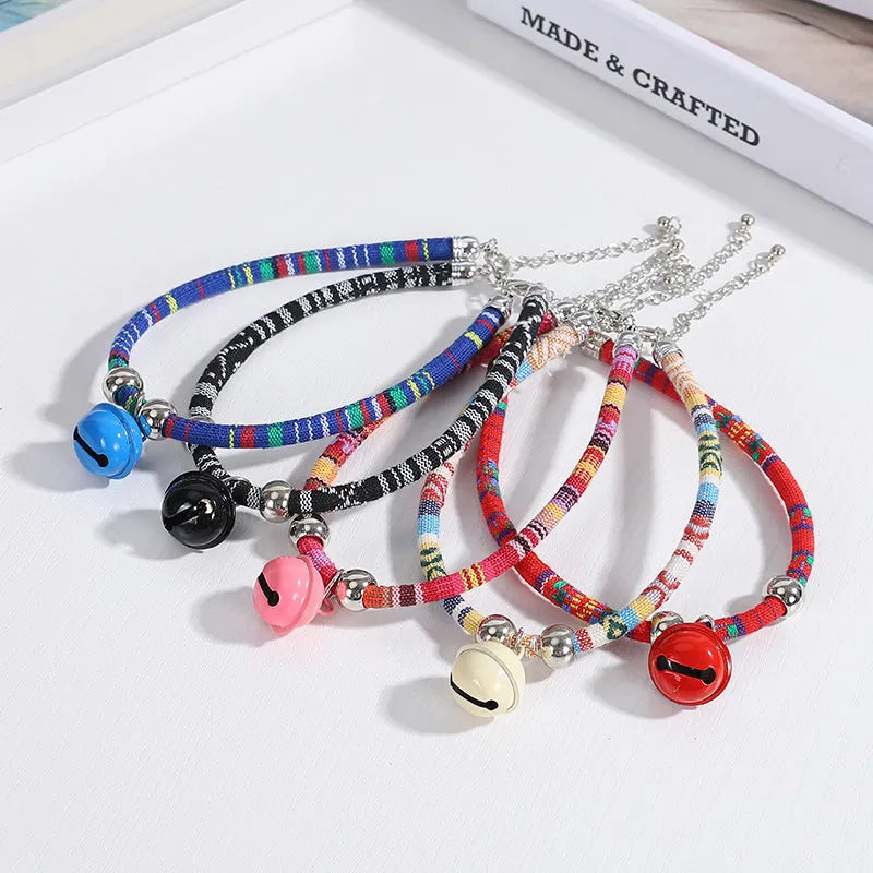 Ethnic style pet collar with bell necklace in five colours including black, blue, pink, red, and white