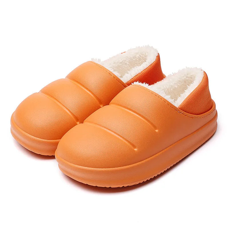 Yellow and green waterproof EVA winter house slippers with plush lining and non-slip sole.