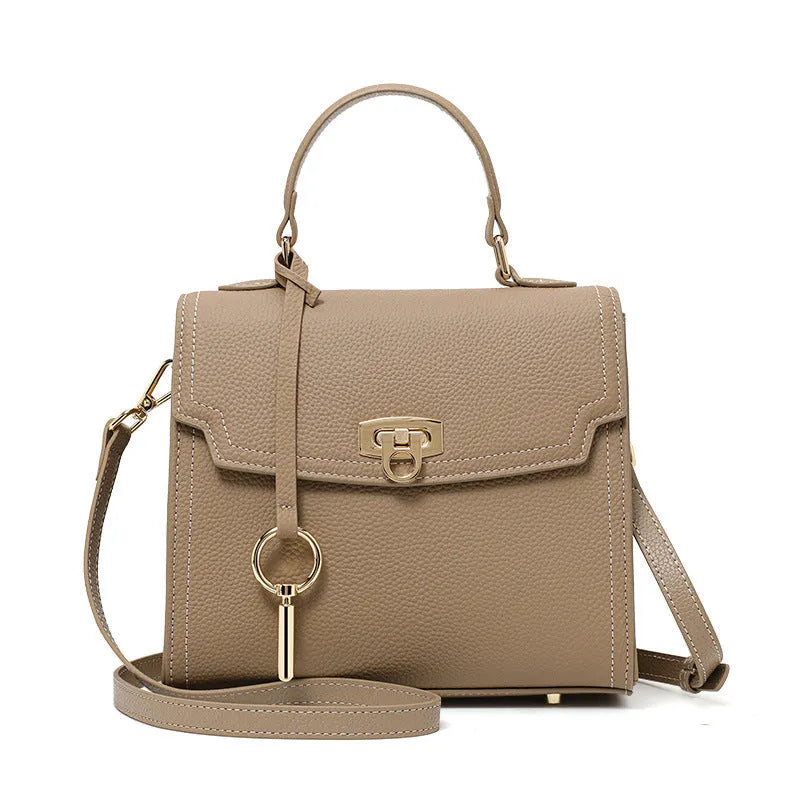 Elephant grey genuine leather handbag with litchi pattern texture and vintage lock closure