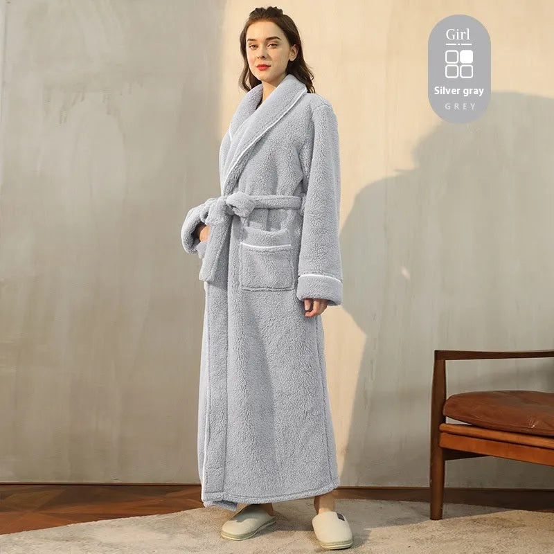 A man and woman wearing matching thickened flannel couple's bathrobes in a winter colour.
